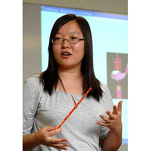 Qinrui Pang speaks at the Torch Scholars talent show