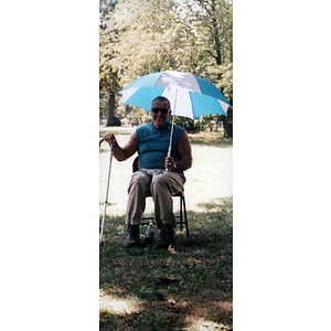 Arthur Warren, Jr. sunbathing at the Snell Library staff picnic