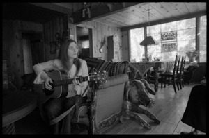 Judy Collins: playing guitar while seated on a couch in Joni Mitchell's house in Laurel Canyon