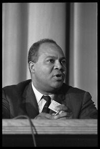 James Farmer, seated on a panel at the Youth, Non-Violence, and Social Change conference, Howard University