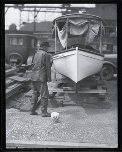John P. Johnson ("Armless Johnson"), painting a boat, the Rymes