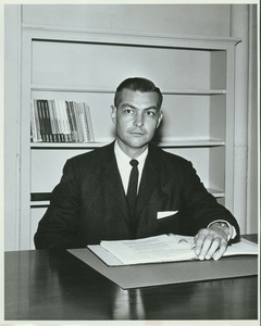 Robert H. Brand sitting behind desk