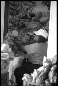 Woman selling produce in the new marketplace, Belize City