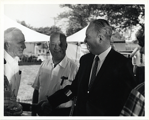 Mayor John F. Collins meeting two unidentified men