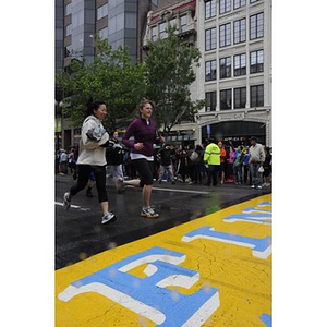 A couple of "One Run" participants approach the Copley Square finish line