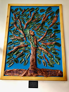 Community book tree mural at the Ventress Memorial Library