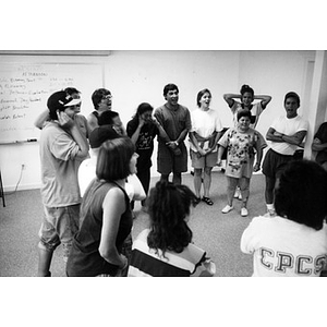 Inquilinos Boricuas en Acción staff members standing in a circle and yelling at a staff retreat.