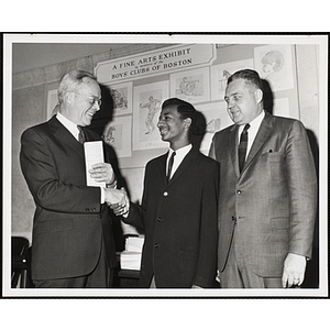 Donald M. DeHart addresses an audience of children at a Boys' Club of Boston St. Patrick's Day inaugural ball and exercises event