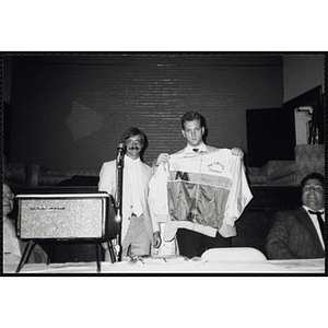 Jerry Steimel, at left, posing with an unidentified man displaying a Charlestown Boys & Girls Club jacket at a Boys & Girls Club Awards Night