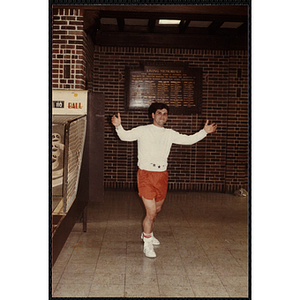 A Man poses for a photo in the recreation room during an open house