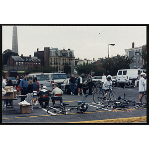 Race officials and riders occupy a parking lot during the Charlestown Bike Race