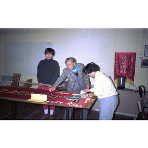 Members decorate for a Chinese Progressive Association anniversary event