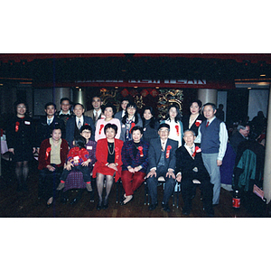 Members of the Chinese Progressive Association pose for a group photo at a restaurant for celebration of the Chinese New Year