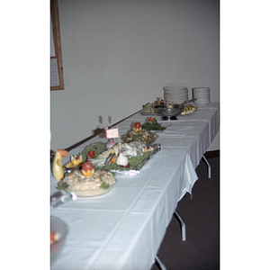 Food and plates sit on a table