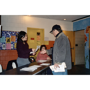 Two men talking at a voter rights event