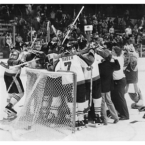 Men's ice hockey team celebrating after Beanpot Tournament win