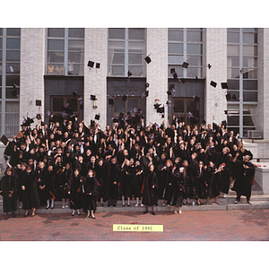Law School Class of 1991 graduates throw their hats on the steps of Ell Hall