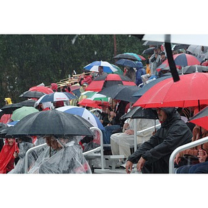 Northeastern fans watch the game in the rain