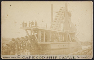 Cape Cod Ship Canal, cabinet card of a bucket dredge with men standing on the upper deck, Sandwich, Mass.