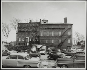 Side view of Otis House, showing retaining wall, after the demolition of the West End