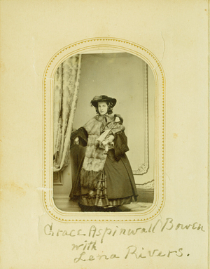 Full-length studio portrait of Grace Aspinwall Bowen, standing, facing front, holding her doll, Lena Rivers, location unknown