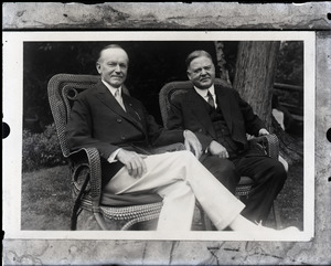 Calvin Coolidge and Herbert Hoover, seated in lawn chairs (l. to r.)