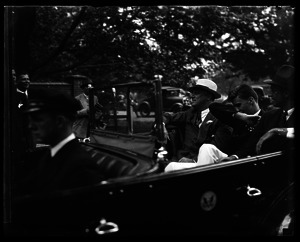 Franklin Delano Roosevelt and son Franklin , Jr., riding in his Ford Phaeton convertible