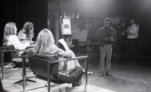 Commune members at the WGBY Catch 44 (public access television) interview: view from the rear of Jim Baker, Bruce Geisler, and Anne Baker on stage