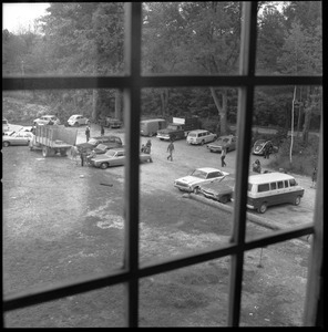 View out the upper window of automobiles parked in front of the Brotherhood of the Spirit commune house in Warwick, Mass.