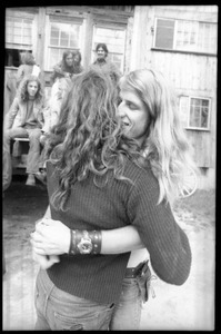 Michael Metelica hugging an unidentified woman in front of the Warwick dormitory, Brotherhood of the Spirit commune