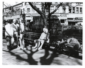 Statues and people in Greenwich Village