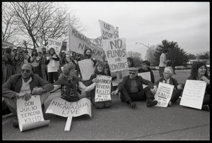 Protests against U.S. intervention in Nicaragua at Westover Air Force base: protesters seated on the pavement, including Frances Crowe (second from right)