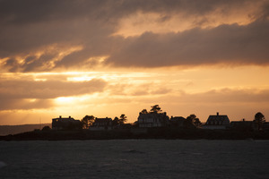 Houses on a point of land at sunset