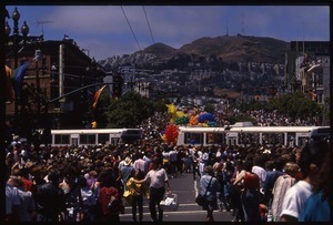 City buses and crowd at the San Francisco Pride Parade