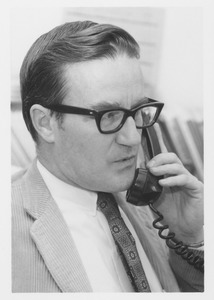Evan V. Johnston speaking on telephone