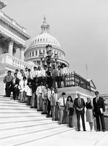 Congressman John W. Olver (3d from right) with visiting group, posed on the steps of the United States Capitol building