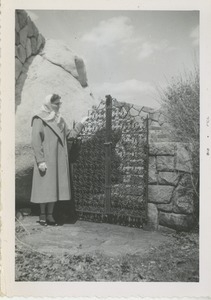 Bernice Kahn standing outside intricate fence