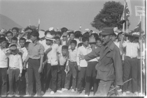 Cao Dai breaking police line to acclaim Gen. Khanh.