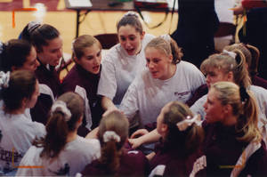 1997-1998 women's gymnastics team huddle