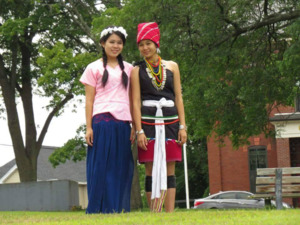 A photograph of Bo Meh and Meh Mo in traditional Karenni clothing in Lowell, Massachusetts, 2014