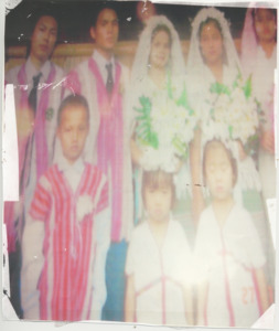 A photograph of Eh Blu Pawl and Tha Taw Moo's wedding in a refugee camp in Thailand, 2008