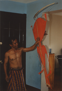 Kite Making: Soeun Tim holds up the kite, 1987