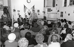 Mayor Raymond L. Flynn with Representative Salvatore F. DiMasi and an unidentified man speaking at a community meeting about North End neighorhood improvements