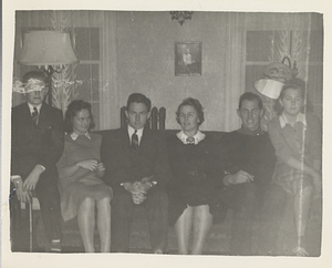 Rosenburgs sit on couch