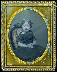 Portrait of seated child