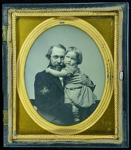 E.G. Story as a child and his father