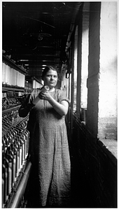 One female textile worker at a spinning frame. [04]