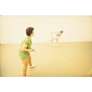 Man and woman playing racquetball