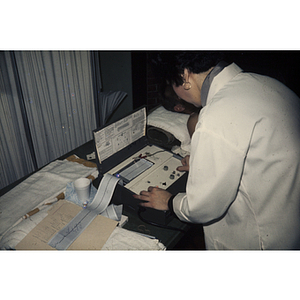 Woman looking at an electrocardiogram readout