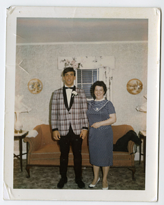 Robert and Deolinda Mello, smiling in living room